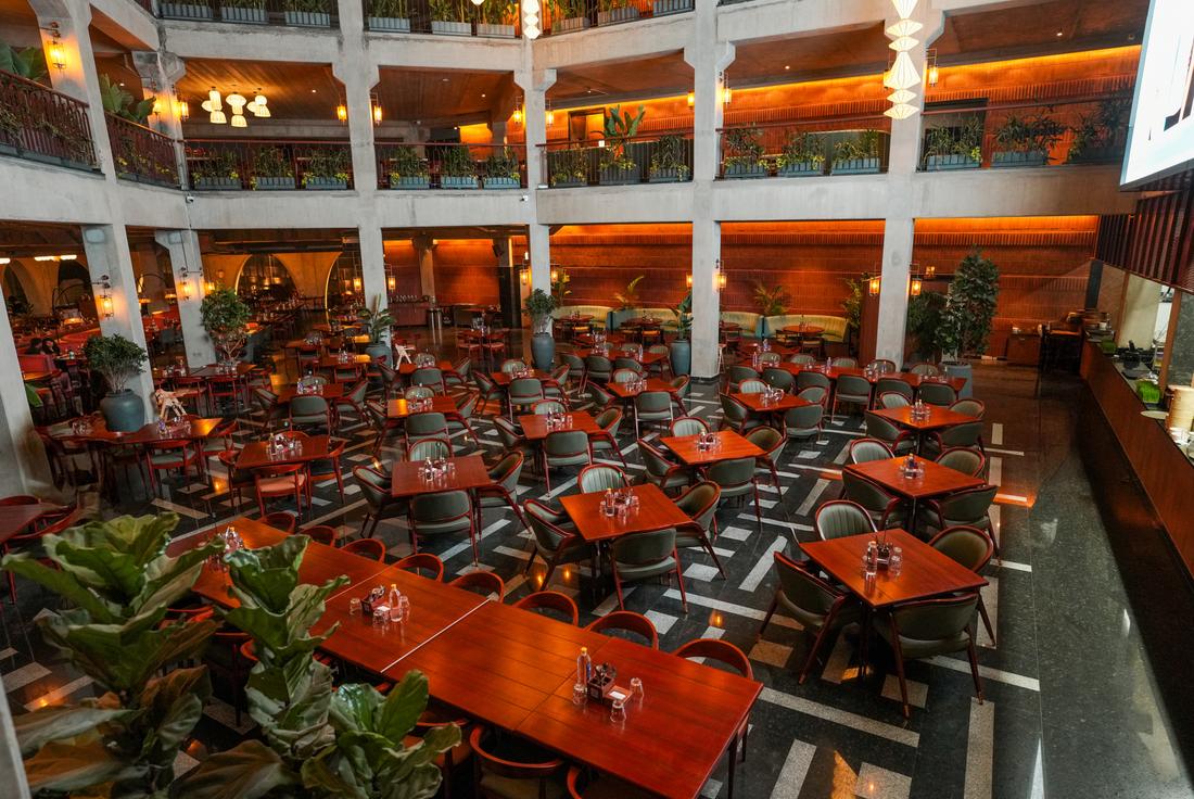 The open three-floor atrium with vertical gardens at Legacy Brewing Company