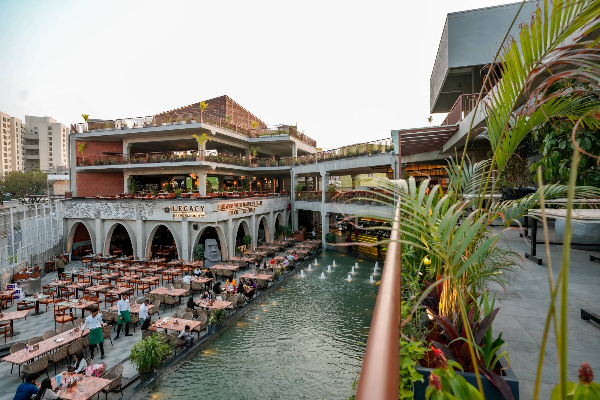 Golden hour open-air rooftop terrace at Legacy Brewing Company